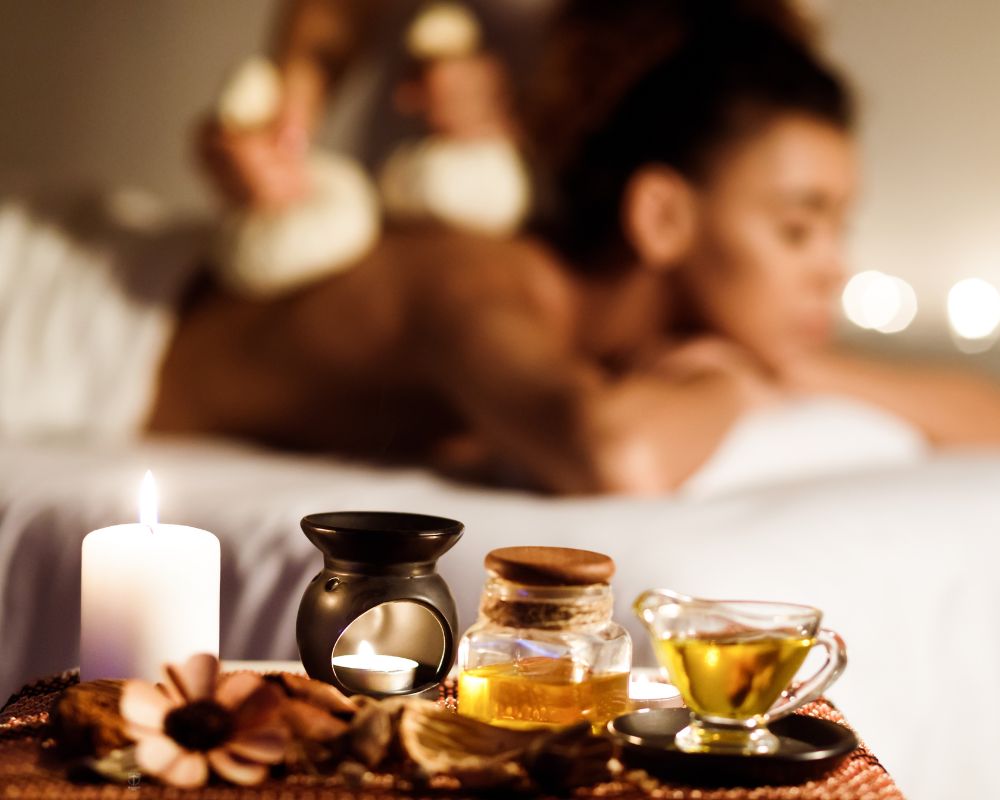 A serene setting where a client enjoys a Thai massage, highlighting the soothing environment