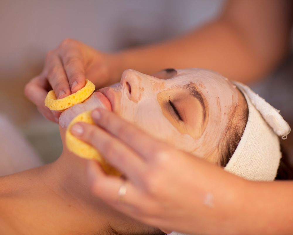 Client enjoying a hydrating facial treatment to restore youthful skin.