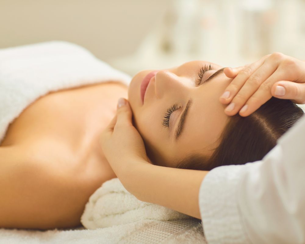 Relaxed client experiencing healing touch of professional massage, revealing psychological wellness through gentle manipulation