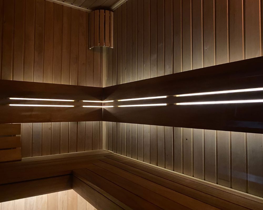 Warm wooden sauna interior with soft lighting at Dragonfly Skin Day Spa Leeds