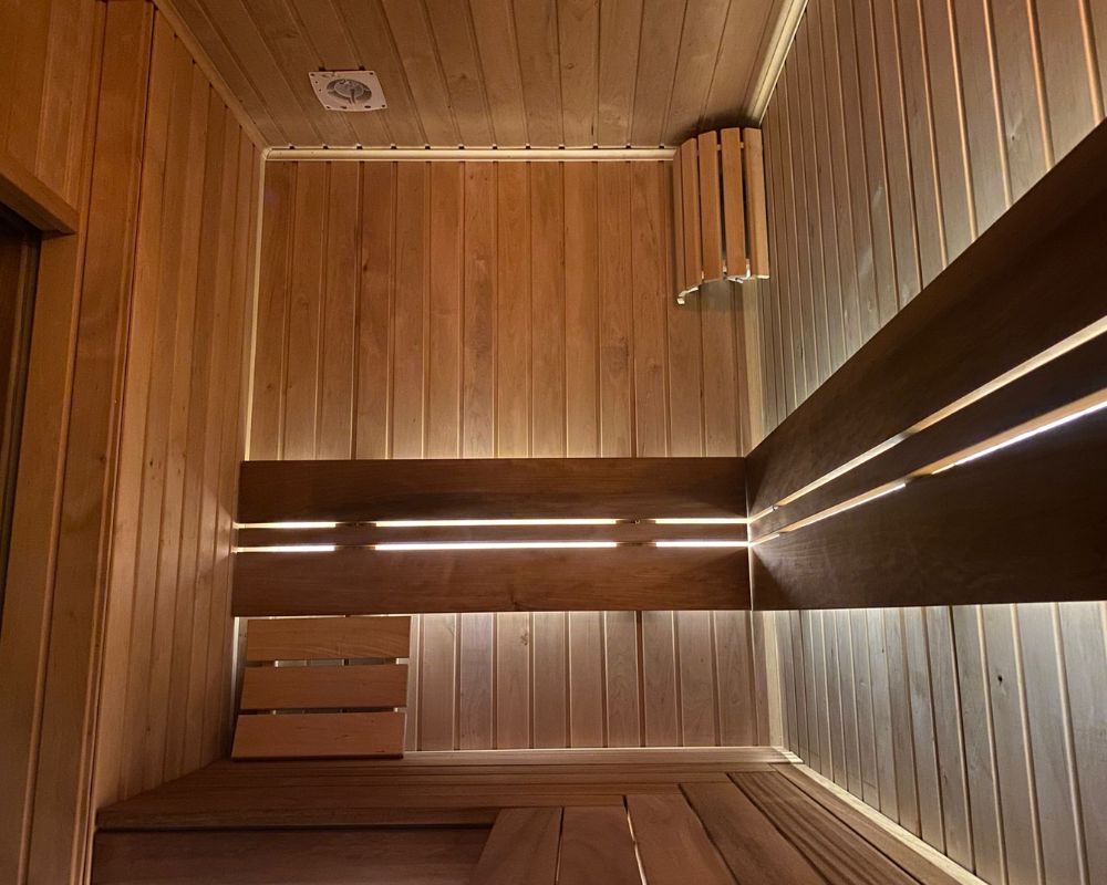 Traditional Finnish sauna interior at Dragonfly Skin Day Spa Leeds for post-workout muscle recovery