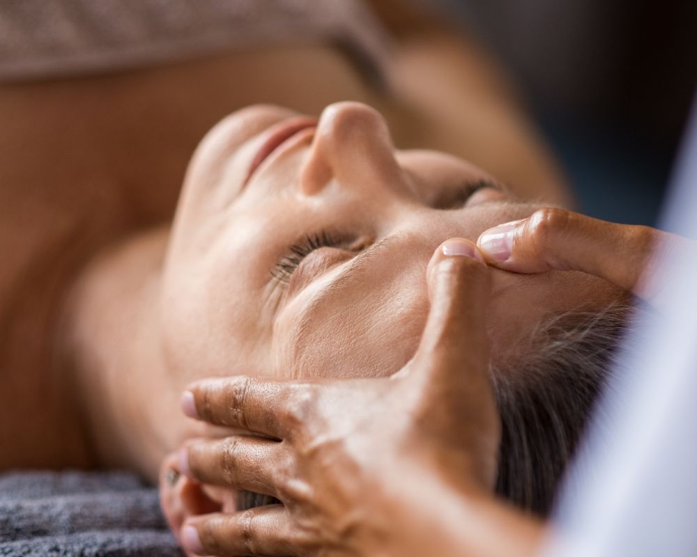 Woman at rest in a spa, face relaxed and eyes closed